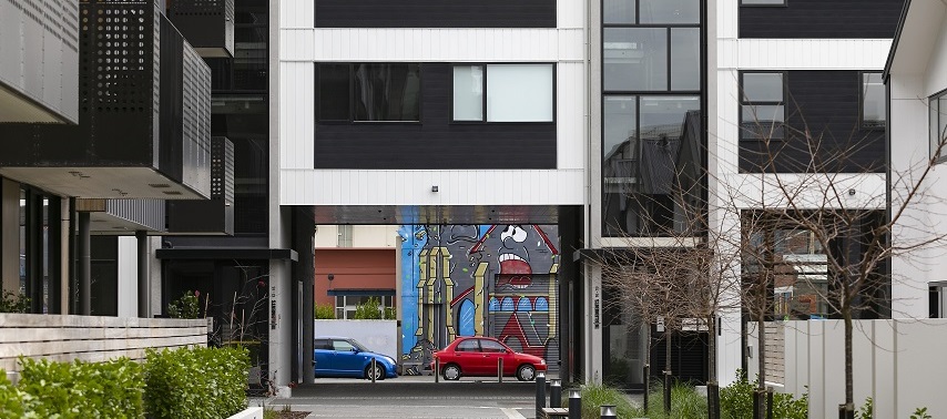 alleyway with two cars at the end
