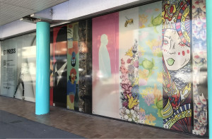 Strips of colourful artwork decorate a window