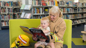 child reading at fendalton library in Christchurch