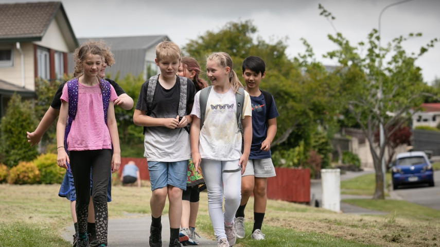 Kids walking to school in Christchurch for Walk or Wheel to School Week